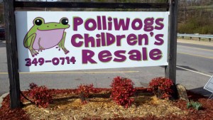 polliwogs kids clothes store sign